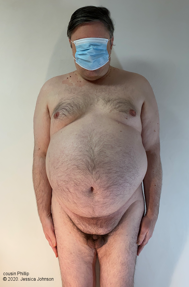 Phillip naked, except for a face mask.